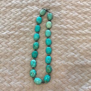 Turquoise necklace with sterling silver spacers.